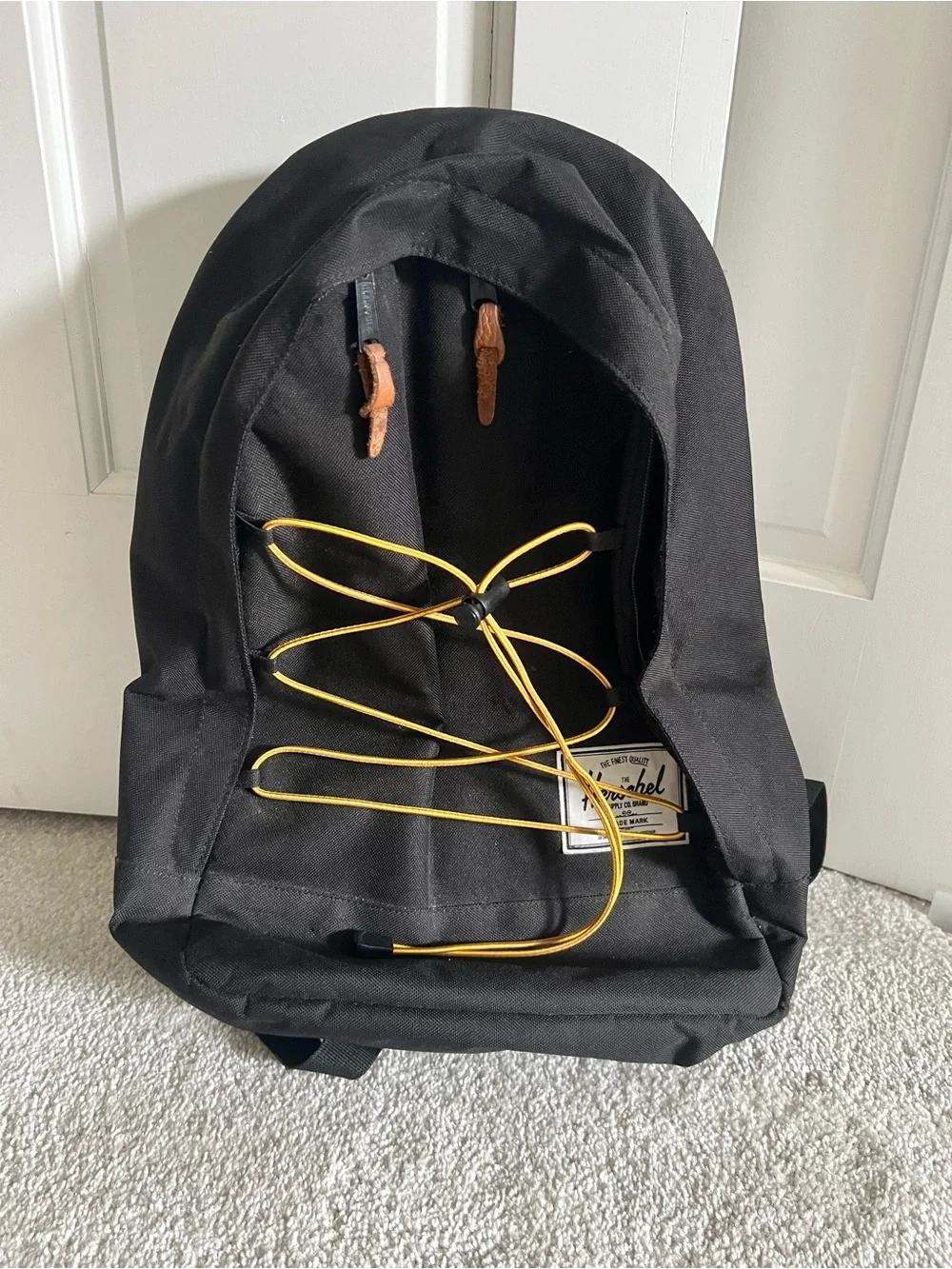 Herschel Black Backpack with Yellow Cord